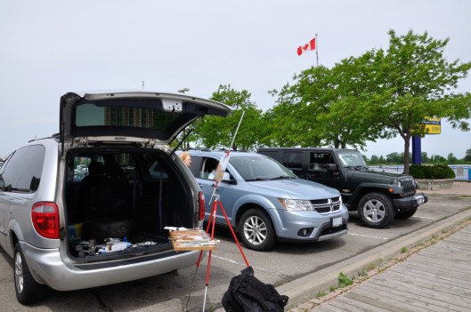 Artists working in their cars to keep warm.  I worked off the back of my van.  Too bad the wind was in my face.  Horizontal flag tells the story.